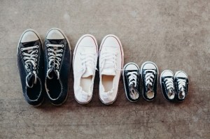 four pairs of sneakers for adults and kids
